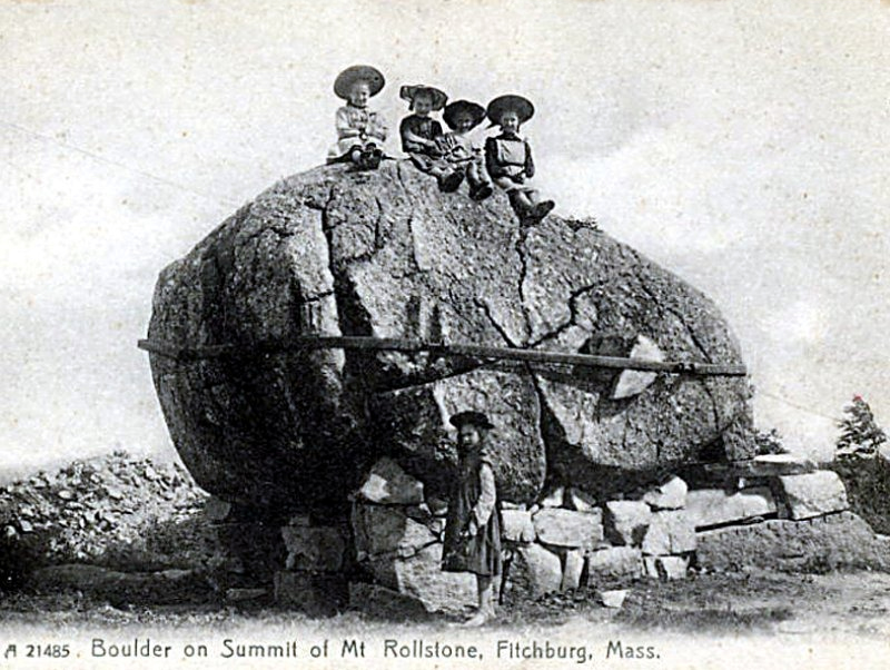 Children playing on Rollstone Boulder in Fitchburg when it sat at the top of Rollstone Hill.