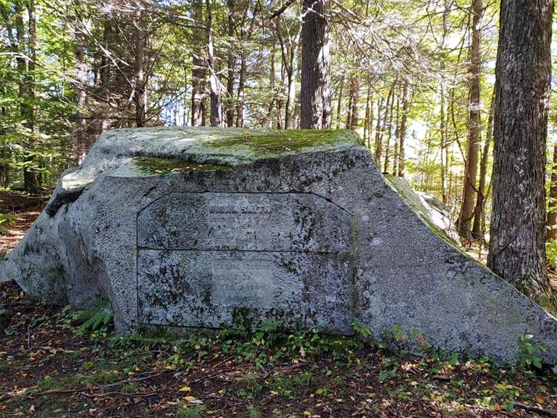The stone tomb grave of Hiram Smith and Isabell Toogood in the woods of Chester, Massachusetts.