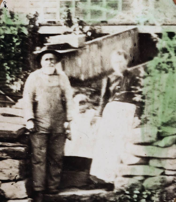 Charles and Mercy Reynolds with one of their daughters at the Reynolds homestead in Hell Hollow. Photo courtesy of Marnie Reynolds-Bourque.